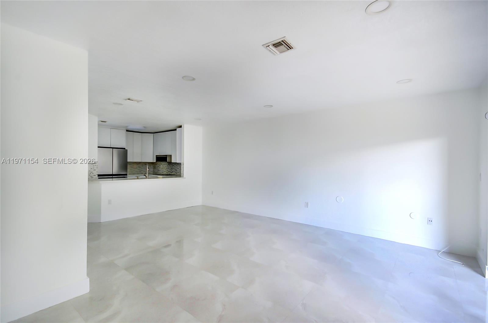 12909 Southwest 61st Terrace Miami, FL 33183 - Photo 7 of 36 a view of empty room with a kitchen