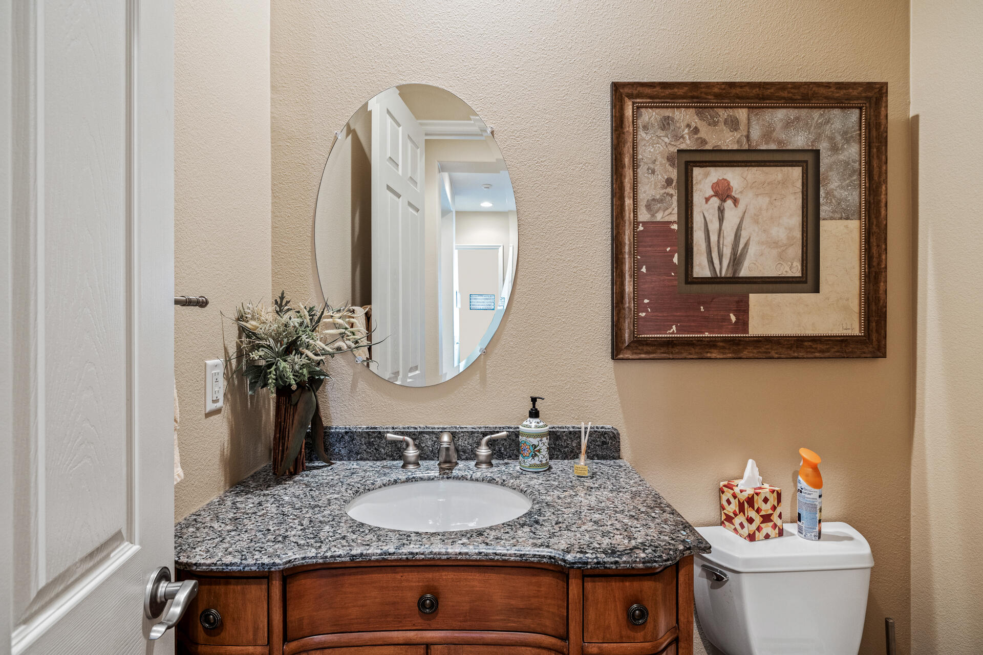 80445 Paria Way Indio, CA 92201 - Photo 12 of 70 a bathroom with a granite countertop sink and a mirror with toilet