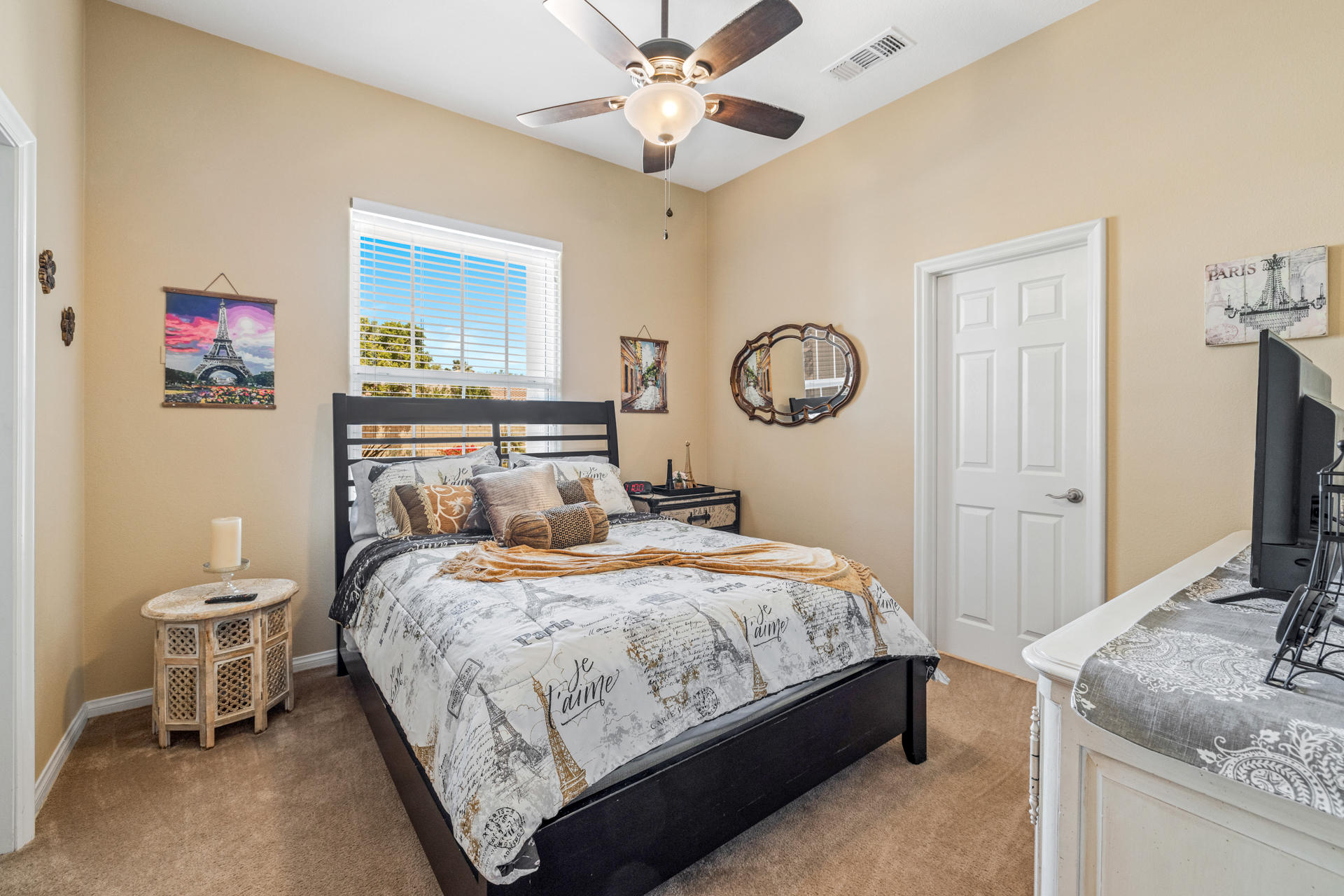 80445 Paria Way Indio, CA 92201 - Photo 15 of 70 a bedroom with a bed and a chandelier
