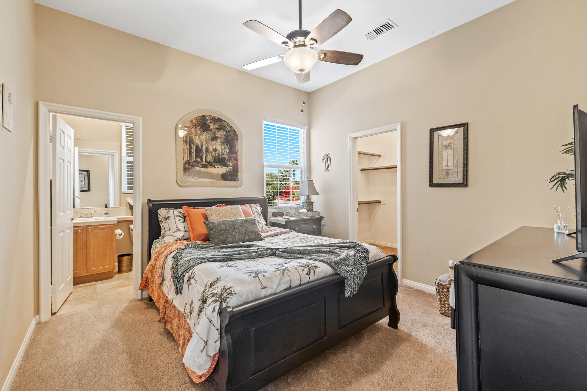 80445 Paria Way Indio, CA 92201 - Photo 16 of 70 a bedroom with a bed and a chandelier