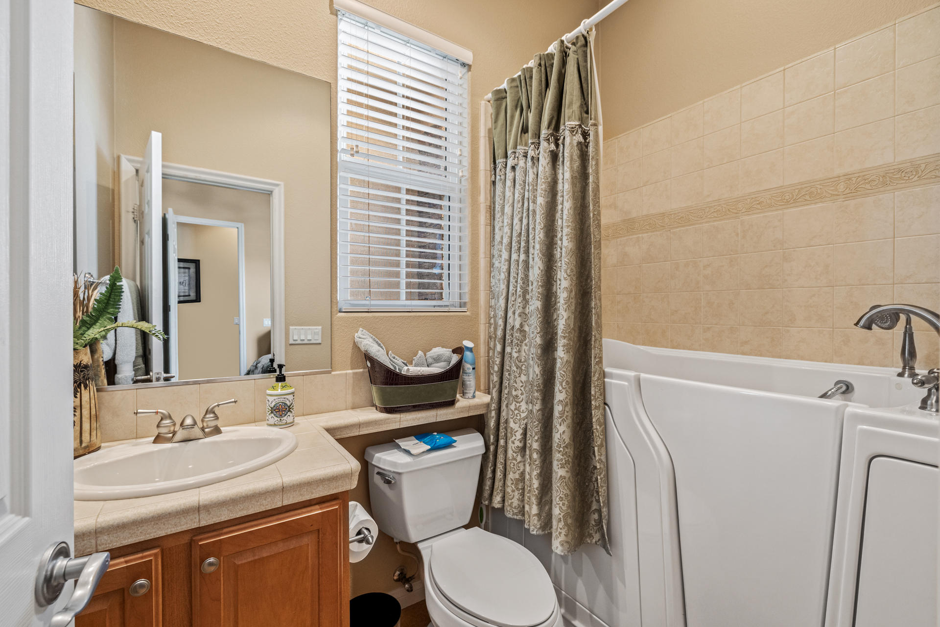 80445 Paria Way Indio, CA 92201 - Photo 18 of 70 a bathroom with a sink a toilet and a mirror