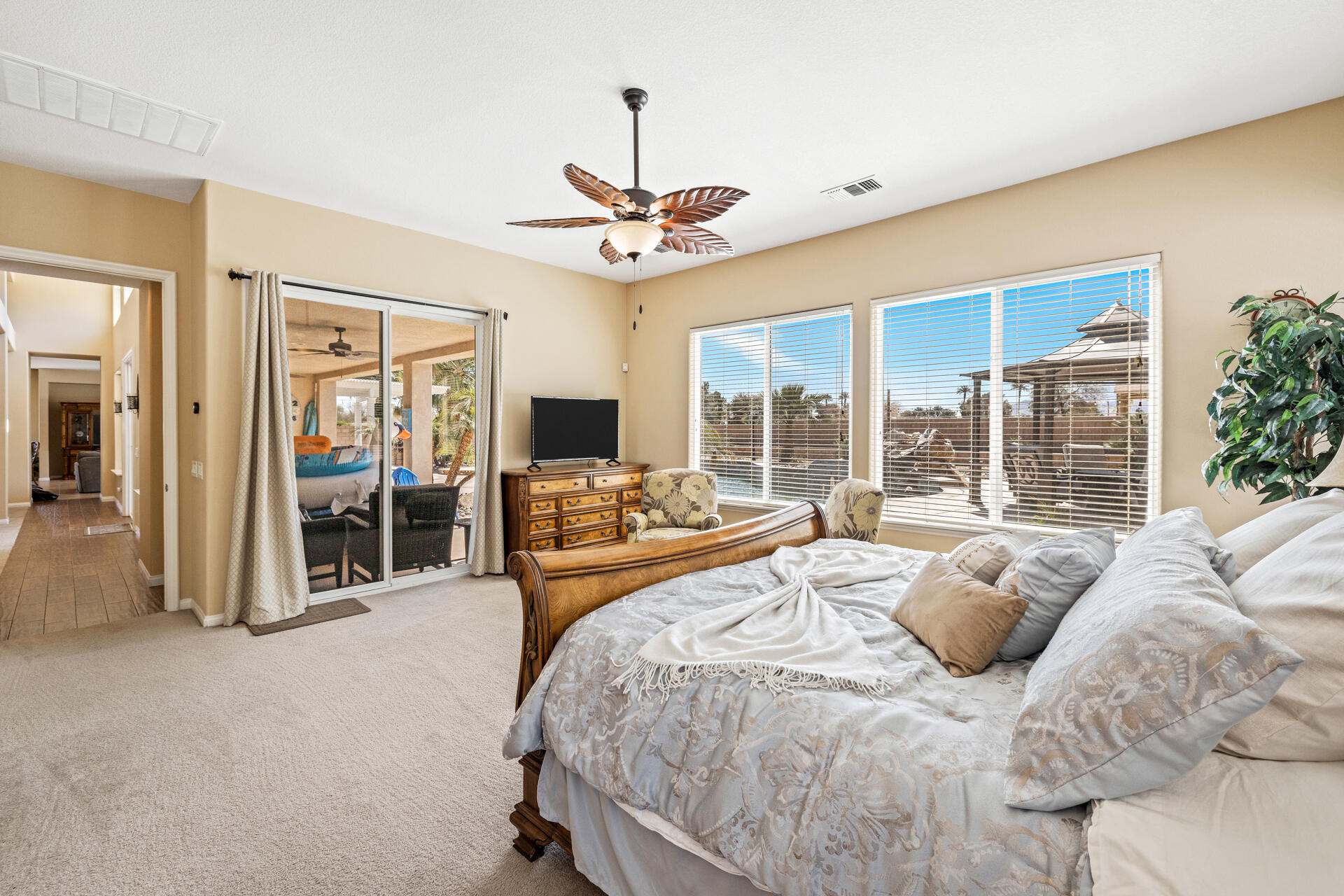 80445 Paria Way Indio, CA 92201 - Photo 24 of 70 a large bedroom with a large bed and a large window