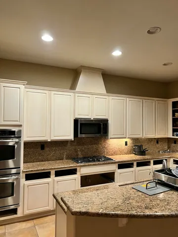 a view of a chair and table of the garden