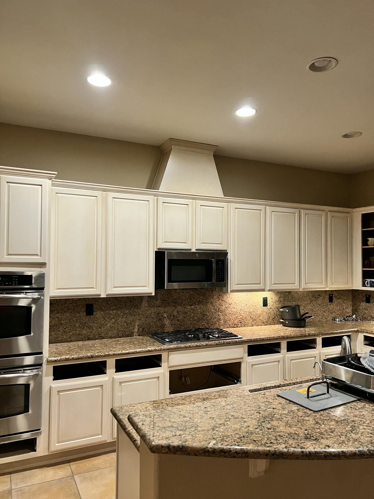 80445 Paria Way Indio, CA 92201 - Photo 32 of 70 a kitchen with granite countertop a stove sink and cabinets