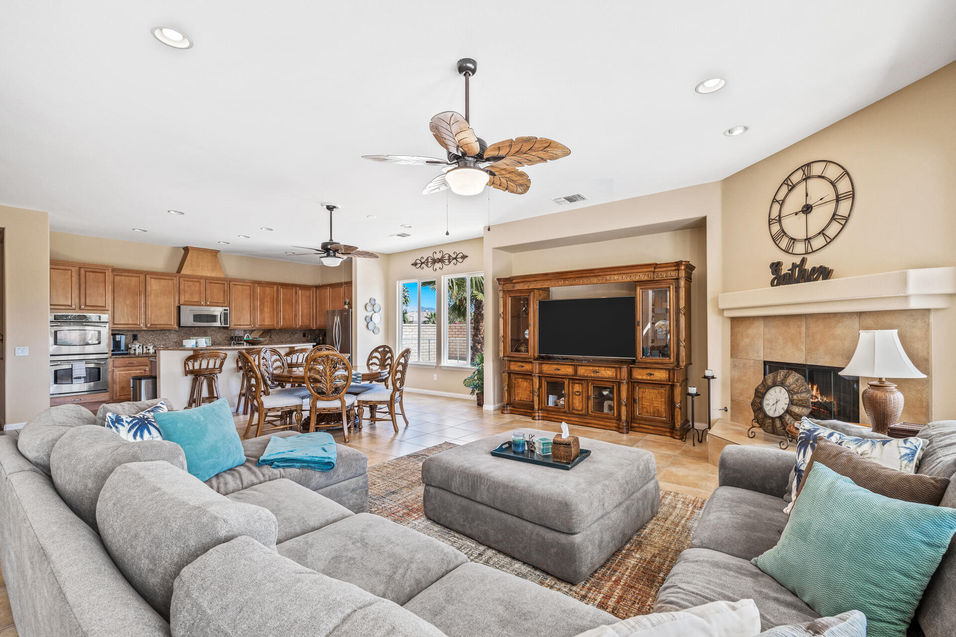 80445 Paria Way Indio, CA 92201 - Photo 34 of 70 a living room with furniture kitchen view and a fireplace