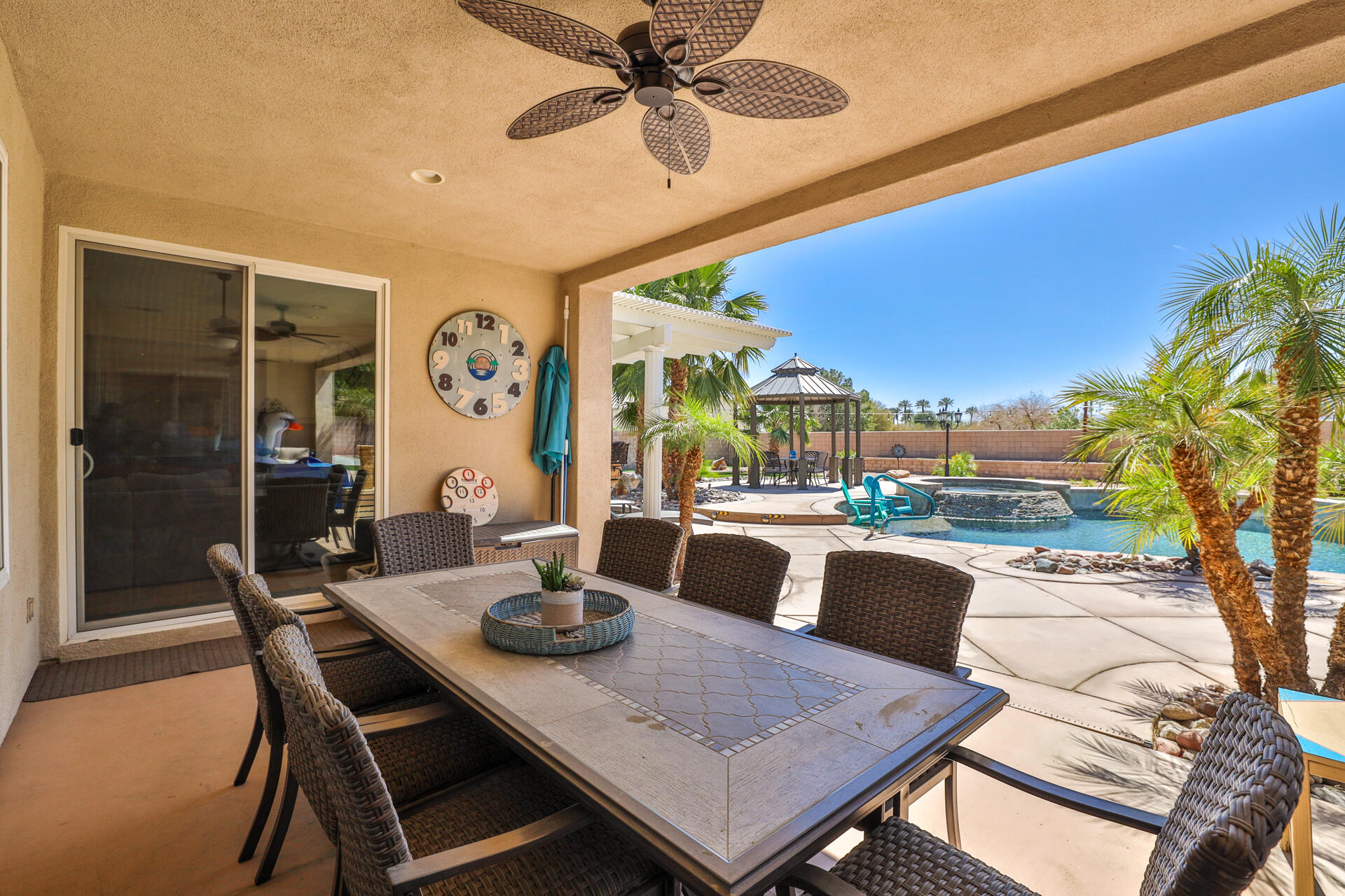 80445 Paria Way Indio, CA 92201 - Photo 35 of 70 a view of a dining room with furniture window and outside view