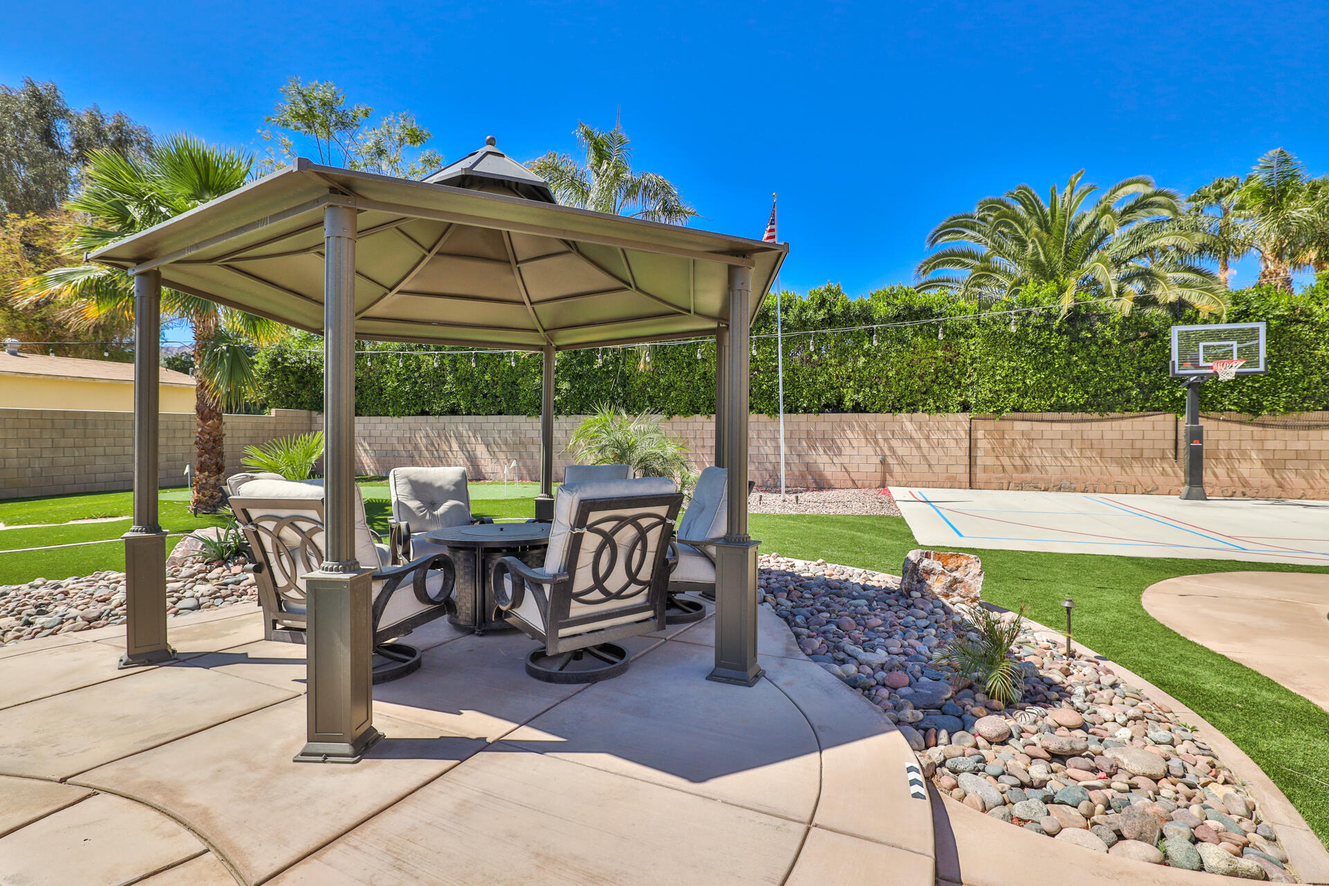80445 Paria Way Indio, CA 92201 - Photo 43 of 70 a view of a table and chairs in patio