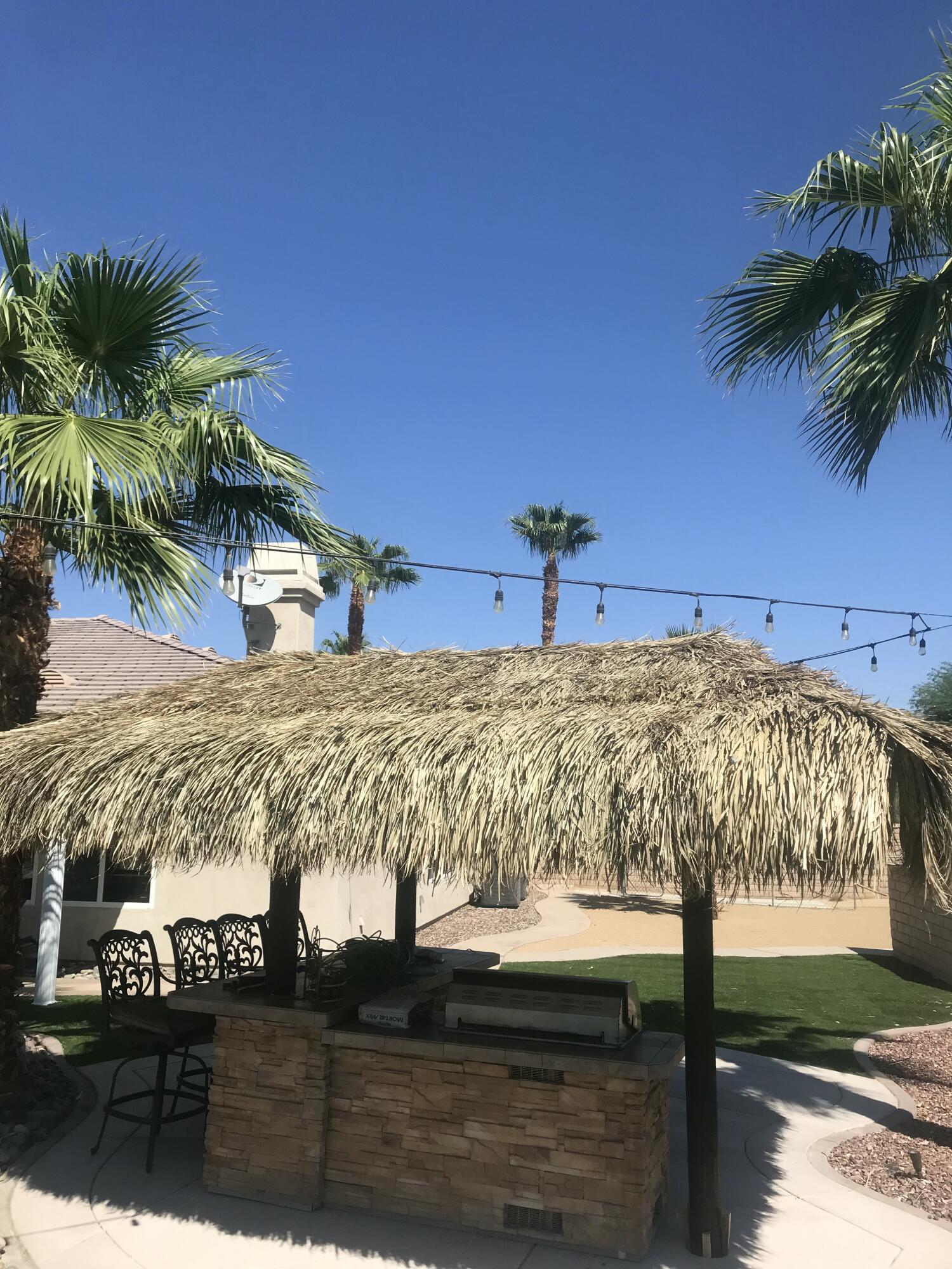 80445 Paria Way Indio, CA 92201 - Photo 68 of 70 a view of swimming pool with a yard
