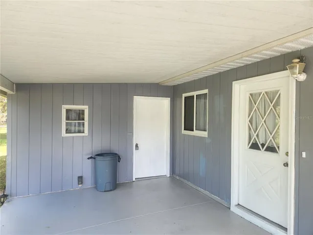 a view of an empty room and a window