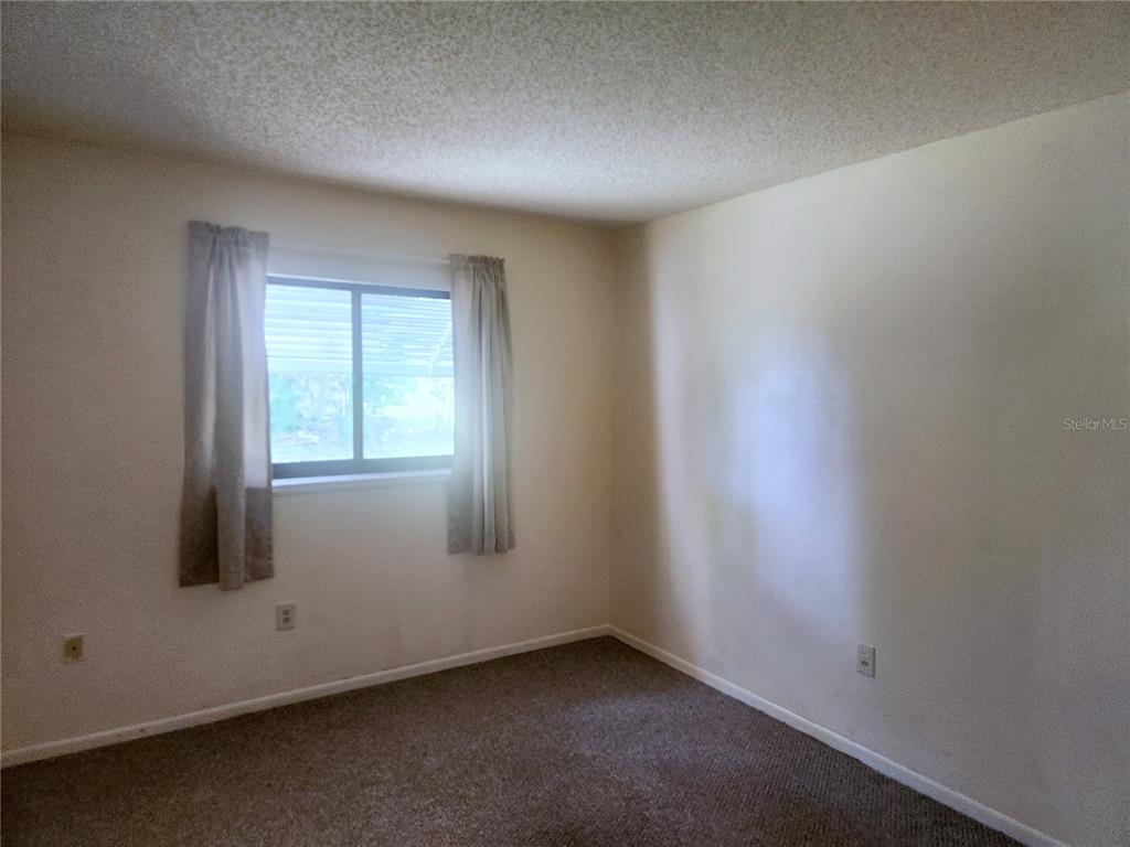 9075 Southwest 104th Lane Ocala, FL 34481 - Photo 6 of 11 an empty room with a window