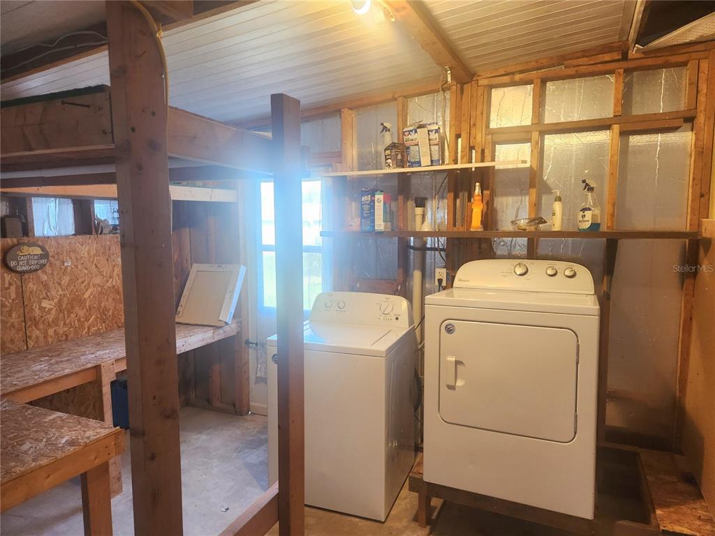 9075 Southwest 104th Lane Ocala, FL 34481 - Photo 10 of 11 a utility room with dryer and washer
