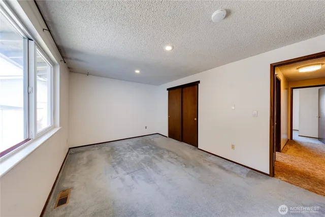 an empty room with windows