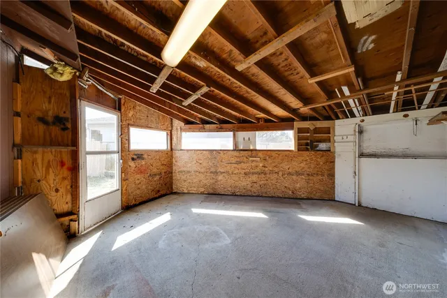 a view of an empty room with a garage