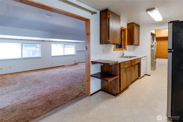 a spacious bathroom with a sink and a mirror