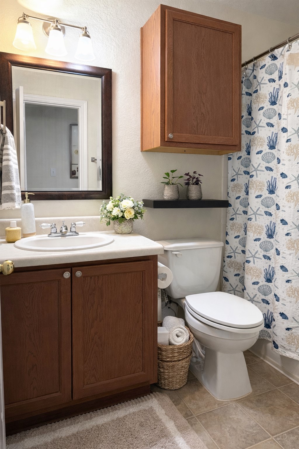 917 Sebastian Bend, Unit B Pflugerville, TX 78660 - Photo 14 of 20 a bathroom with a granite countertop toilet sink and mirror