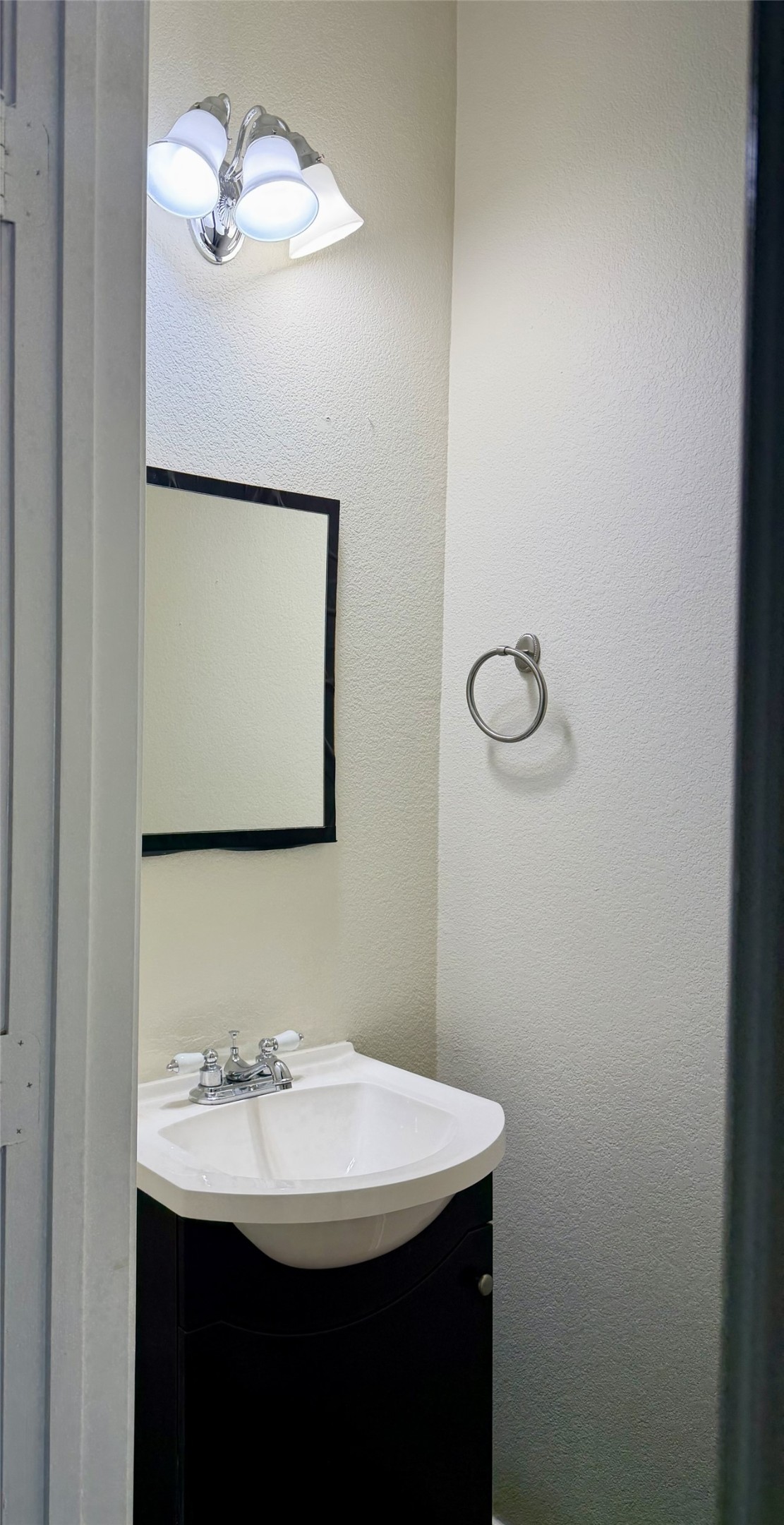 917 Sebastian Bend, Unit B Pflugerville, TX 78660 - Photo 19 of 20 a bathroom with a sink vanity and a mirror
