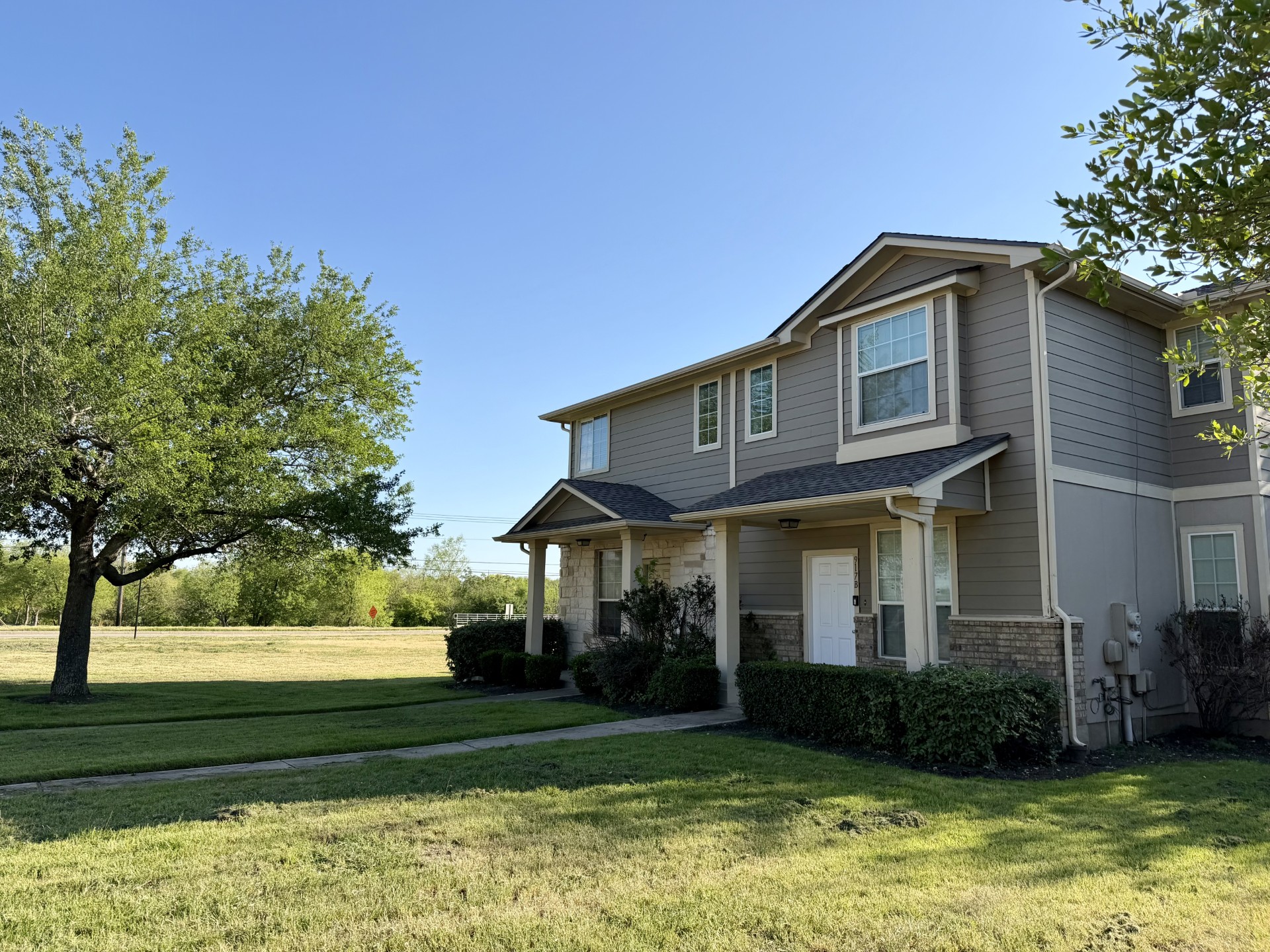 917 Sebastian Bend, Unit B Pflugerville, TX 78660 - Photo 2 of 20 a front view of a house with a yard