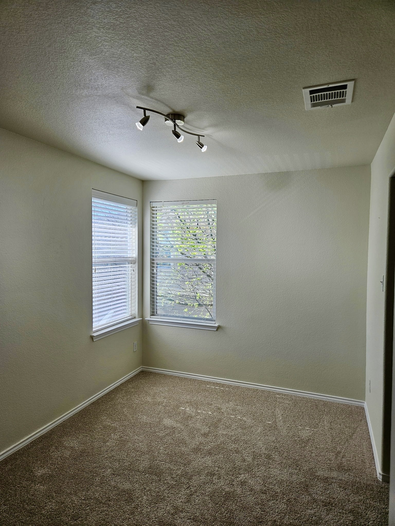 917 Sebastian Bend, Unit B Pflugerville, TX 78660 - Photo 10 of 20 an empty room with a window