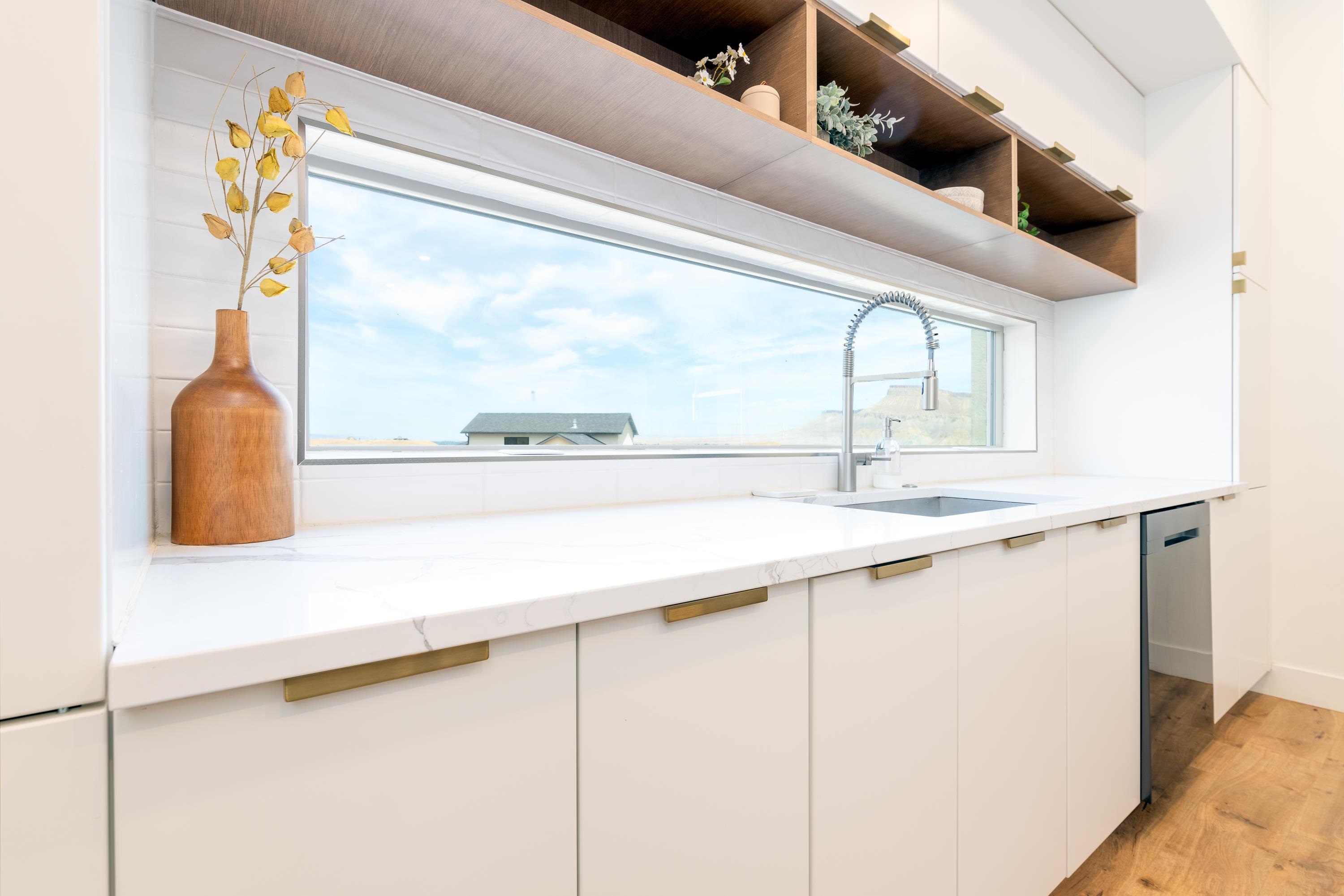 3685 East Road Palisade, CO 81526 - Photo 13 of 42 a kitchen with a sink and a window