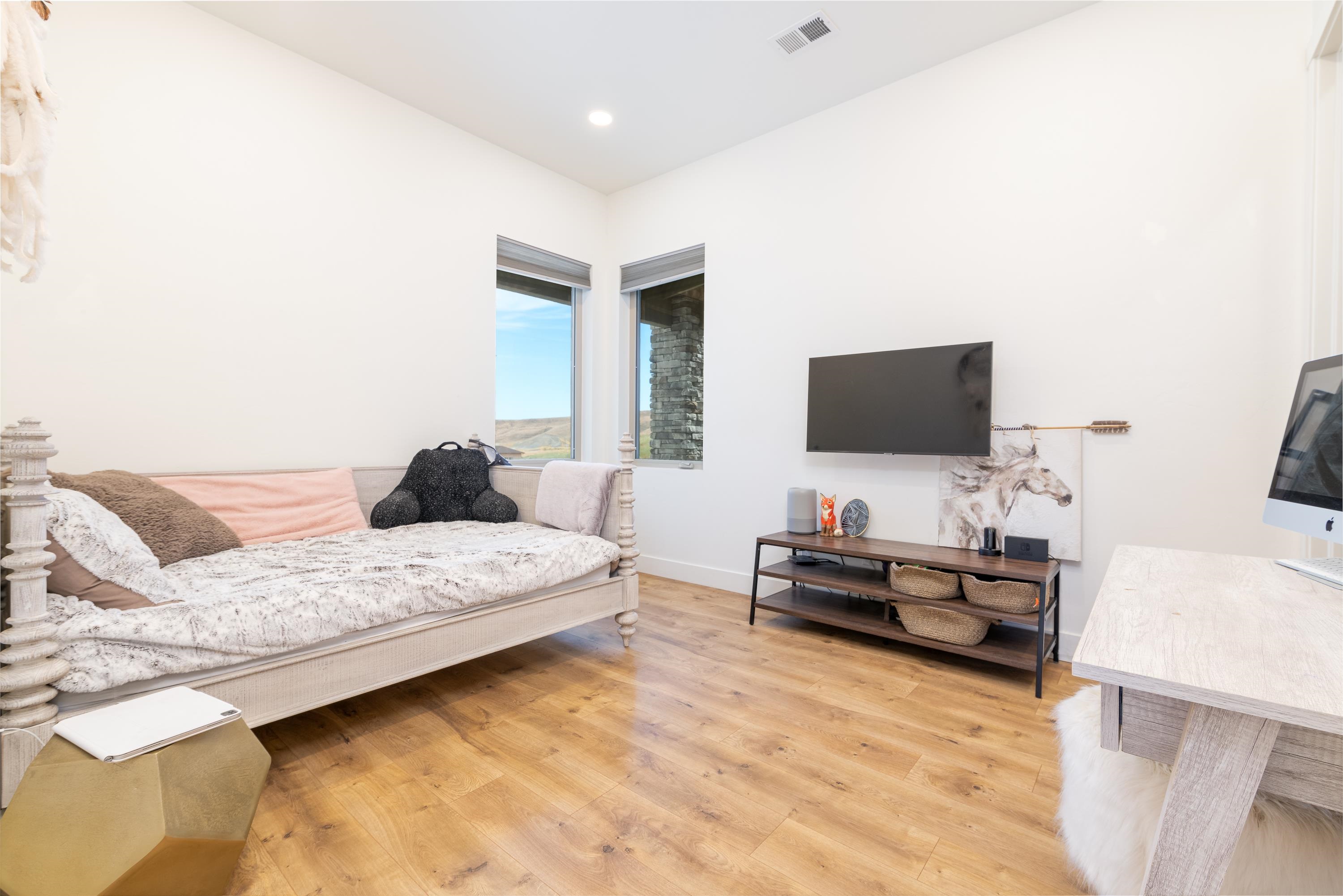 3685 East Road Palisade, CO 81526 - Photo 18 of 42 a bedroom with a bed and flat screen tv