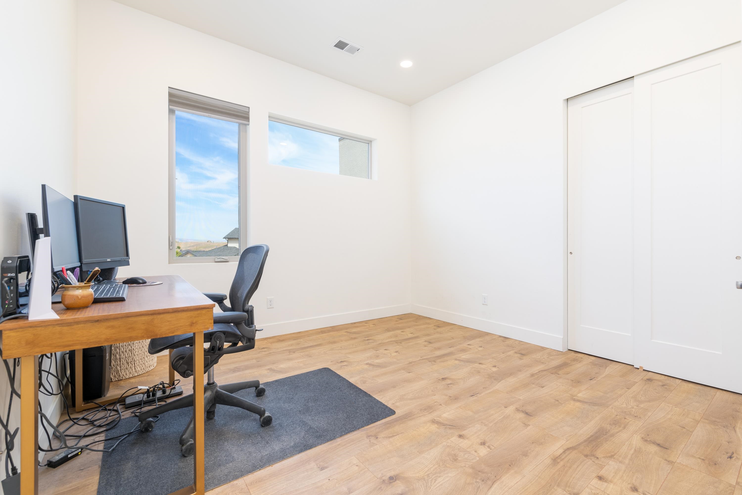 3685 East Road Palisade, CO 81526 - Photo 25 of 42 a view of a workspace with furniture and a window