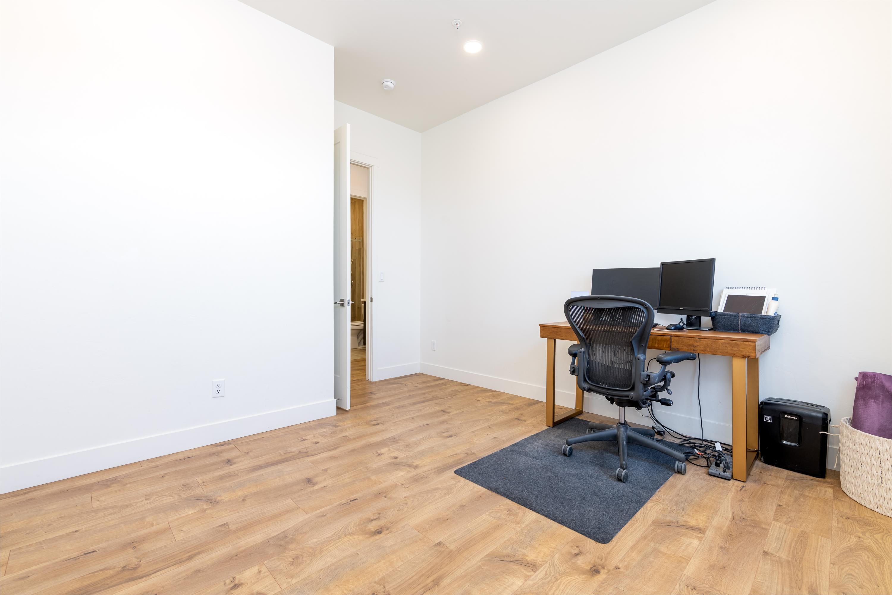 3685 East Road Palisade, CO 81526 - Photo 26 of 42 a view of workspace with wooden floor and bathroom