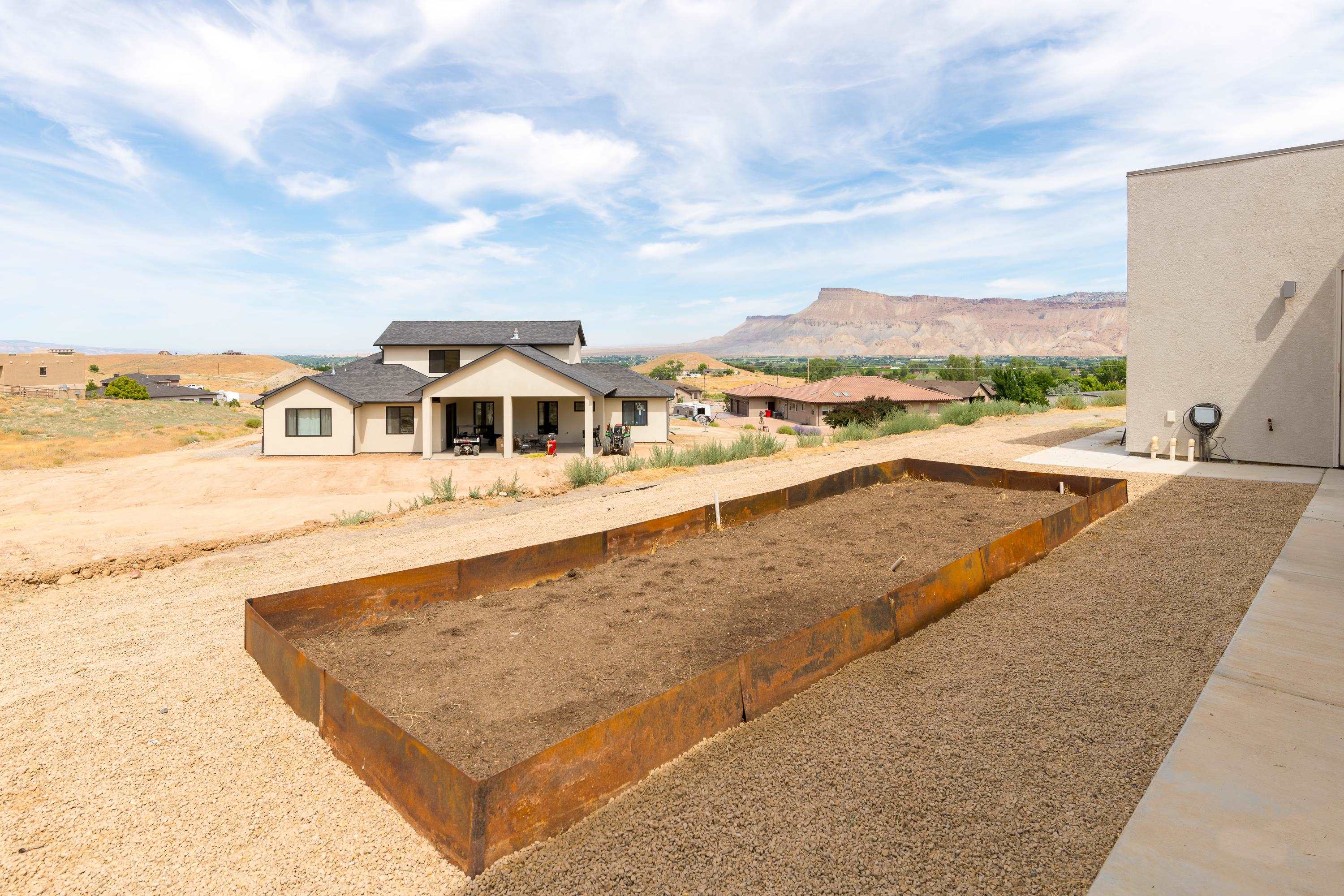 3685 East Road Palisade, CO 81526 - Photo 29 of 42 a view of a swimming pool with an ocean view
