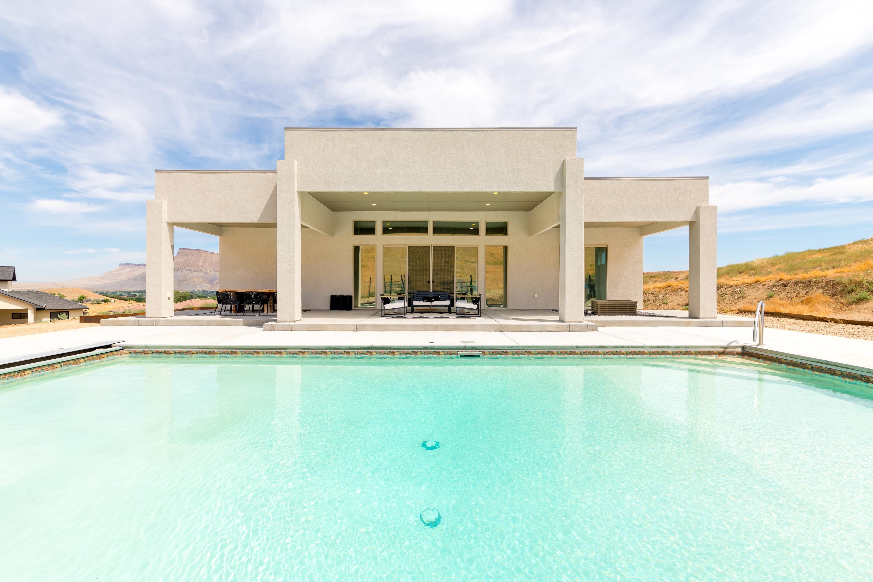 3685 East Road Palisade, CO 81526 - Photo 3 of 42 a view of swimming pool with outdoor seating