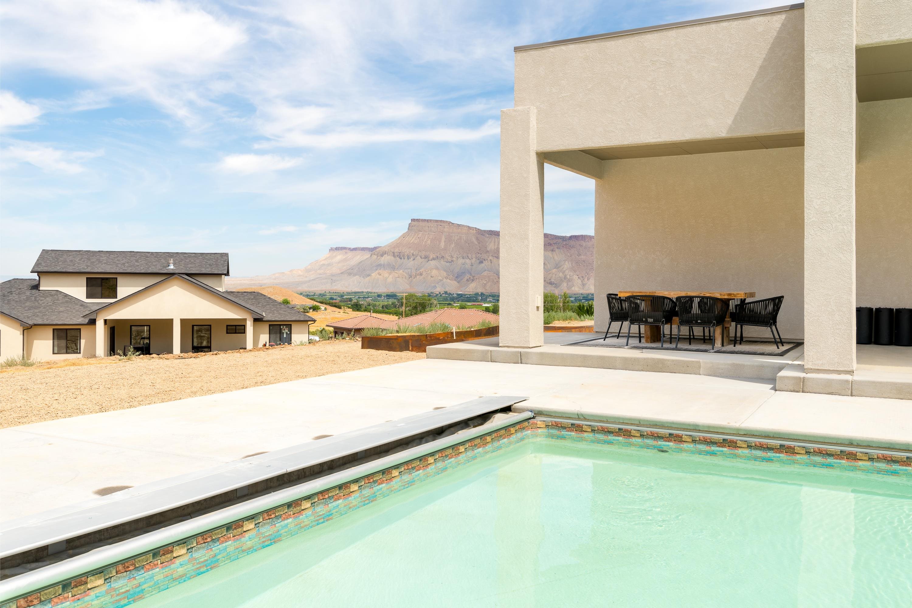 3685 East Road Palisade, CO 81526 - Photo 32 of 42 a view of an house with swimming pool and a yard