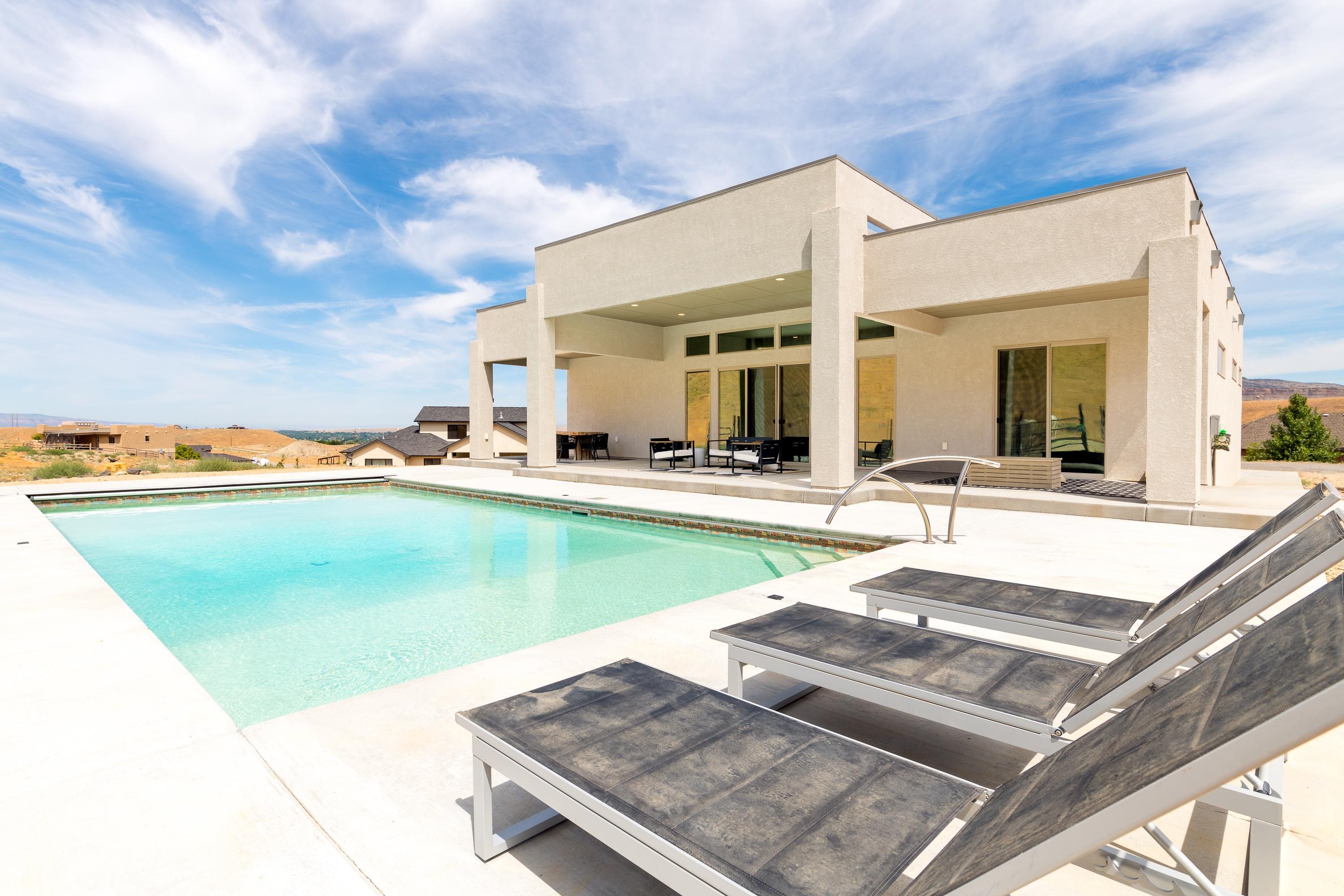 3685 East Road Palisade, CO 81526 - Photo 4 of 42 a view of a house with swimming pool and chairs