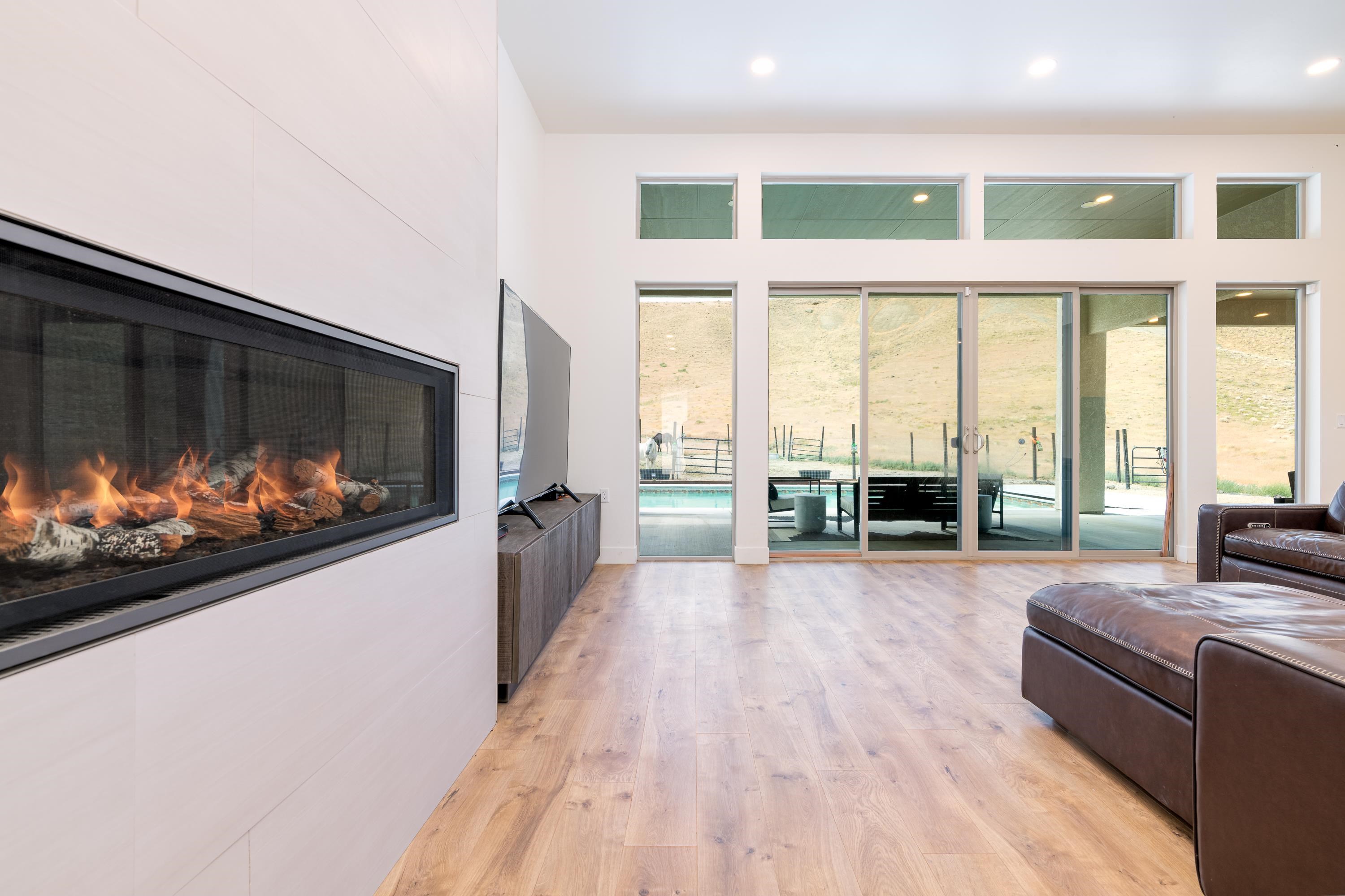 3685 East Road Palisade, CO 81526 - Photo 10 of 42 a living room with furniture fireplace and flat screen tv
