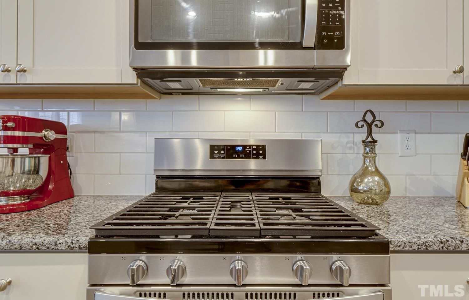 3155 Retama Run New Hill, NC 27562 - Photo 13 of 48 a stove top oven sitting inside of a kitchen