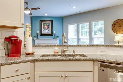 a kitchen with granite countertop a sink and a granite counter tops