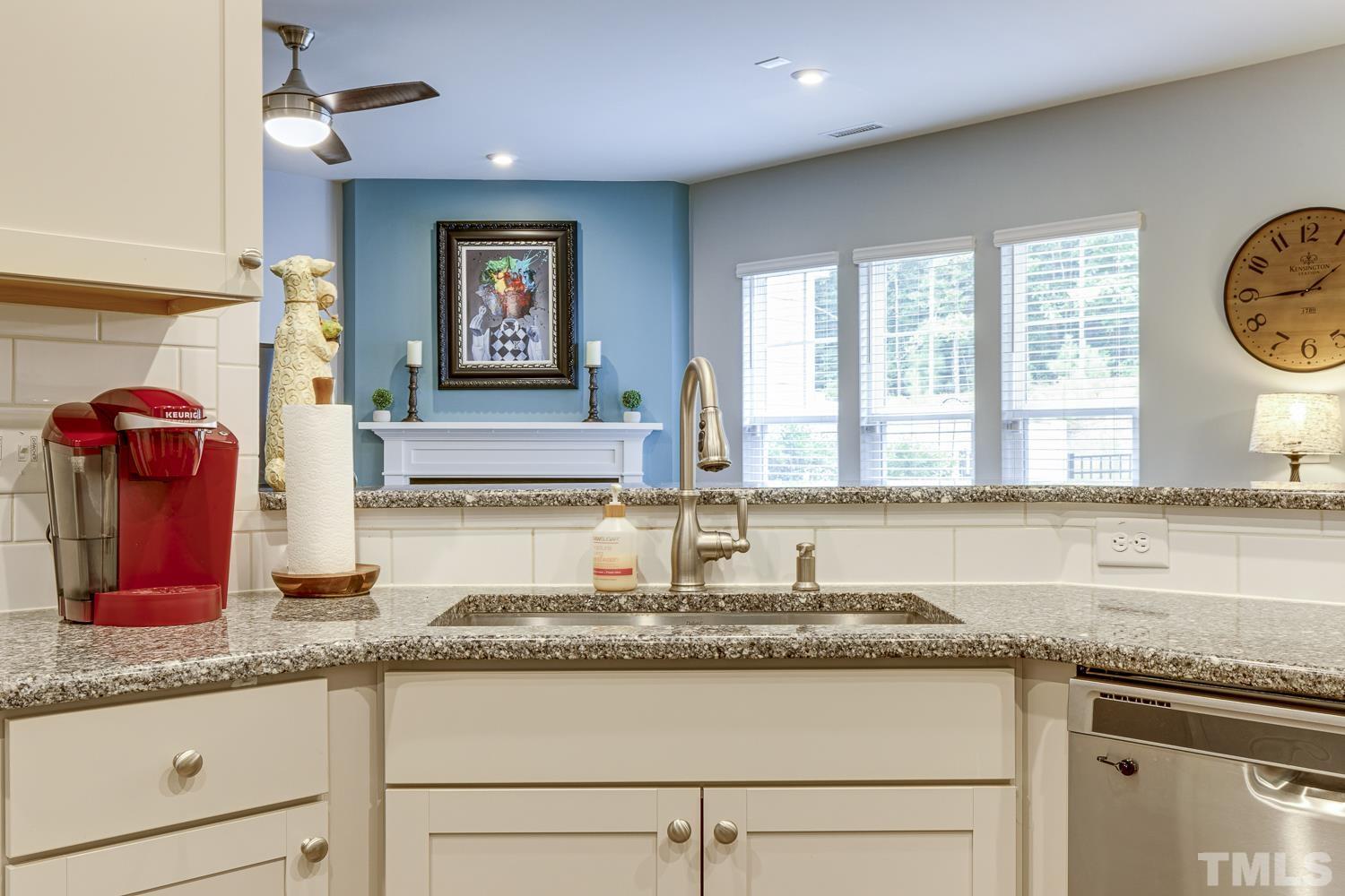 3155 Retama Run New Hill, NC 27562 - Photo 14 of 48 a kitchen with granite countertop a sink and a granite counter tops