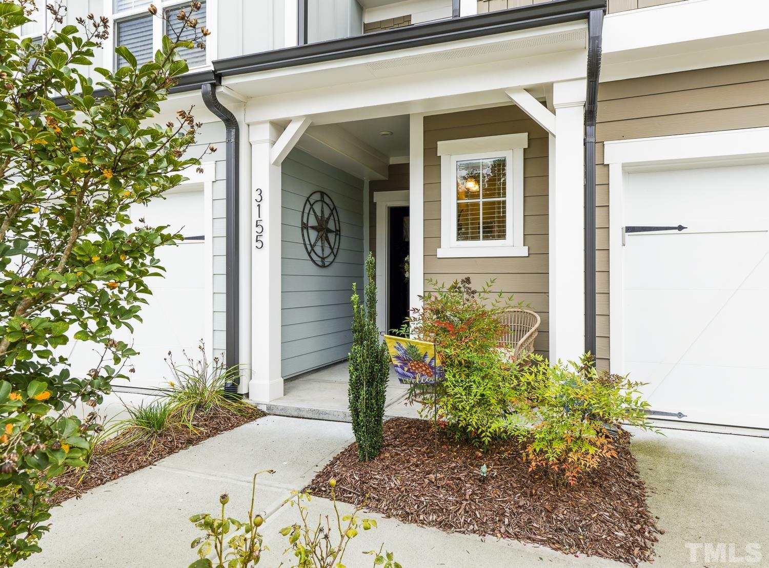 3155 Retama Run New Hill, NC 27562 - Photo 2 of 48 a view of a front door of the house