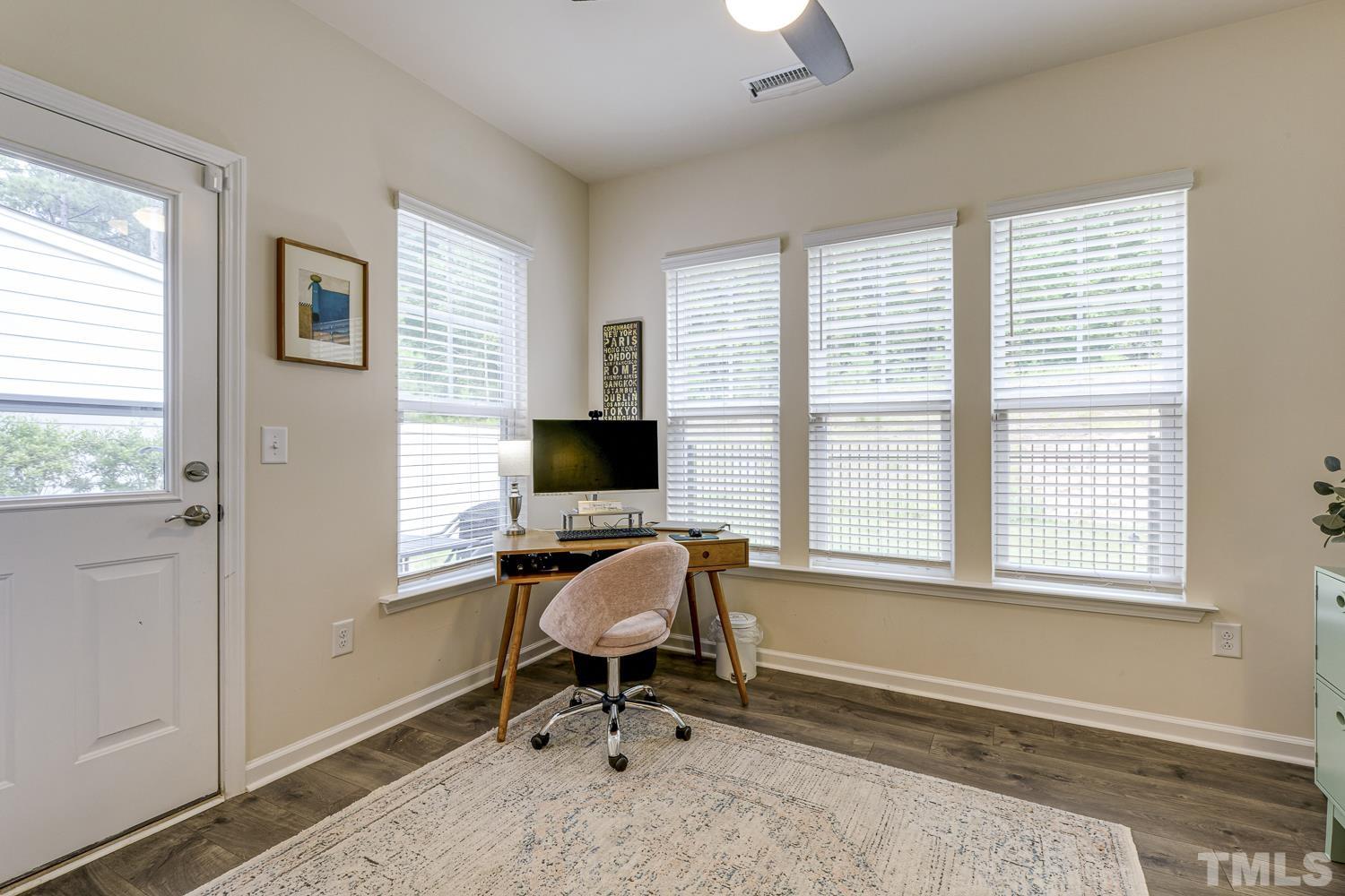 3155 Retama Run New Hill, NC 27562 - Photo 21 of 48 a view of a livingroom with workspace and a window
