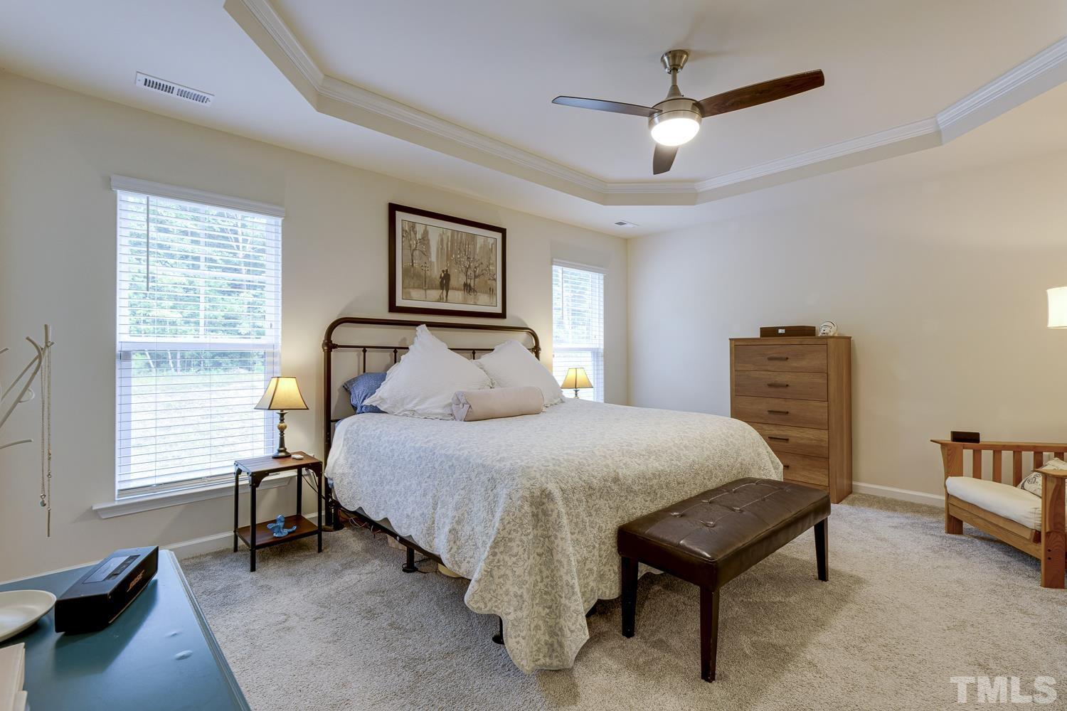 3155 Retama Run New Hill, NC 27562 - Photo 27 of 48 a bedroom with a bed furniture and a window