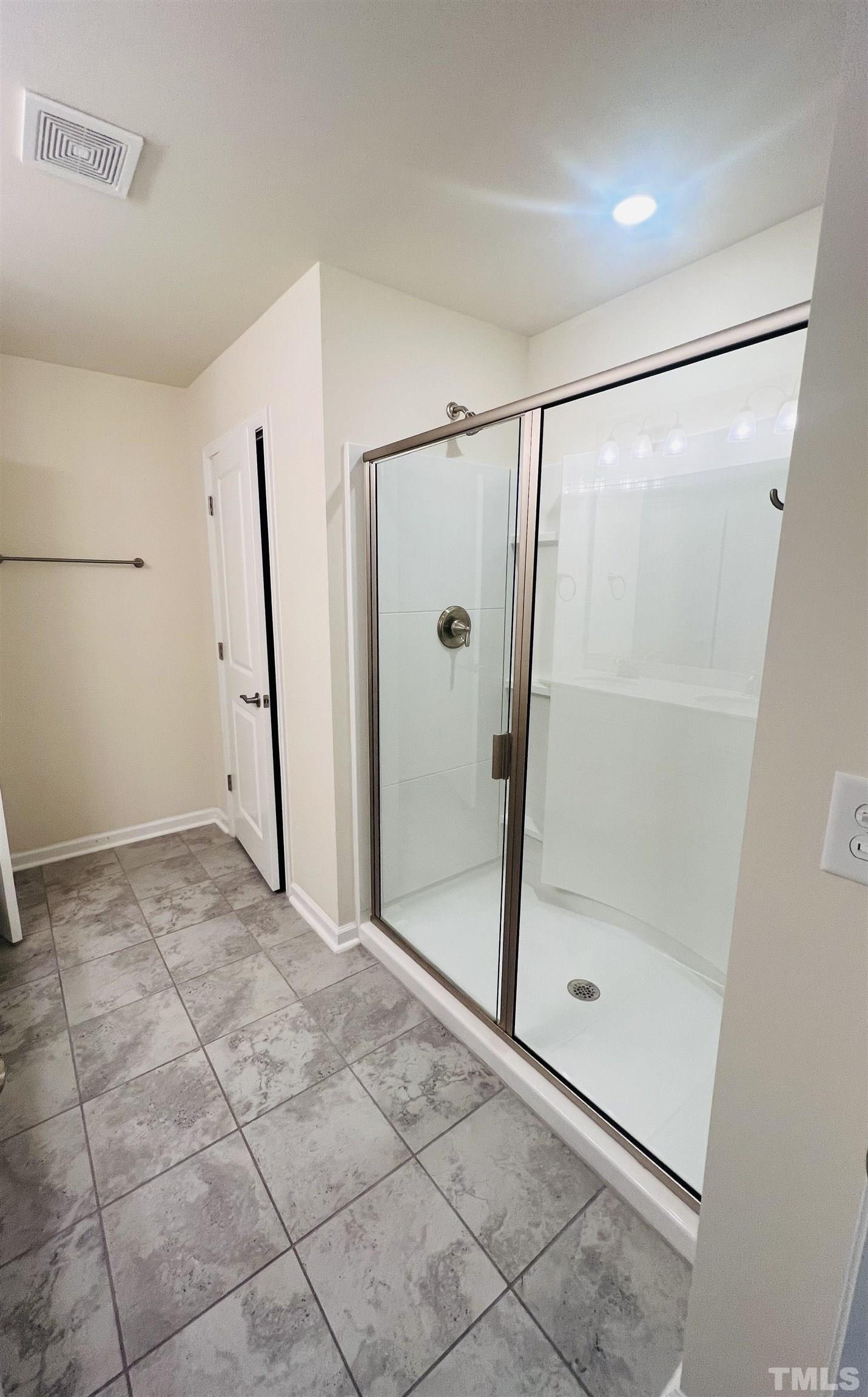 3155 Retama Run New Hill, NC 27562 - Photo 32 of 48 a bathroom with a shower and a glass door