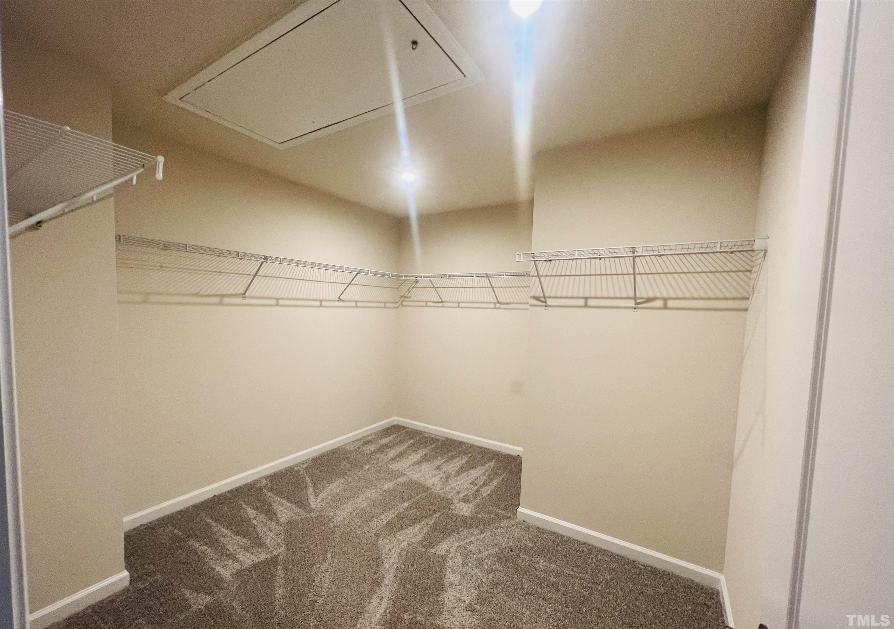 3155 Retama Run New Hill, NC 27562 - Photo 34 of 48 a view of a room with racks on the wall