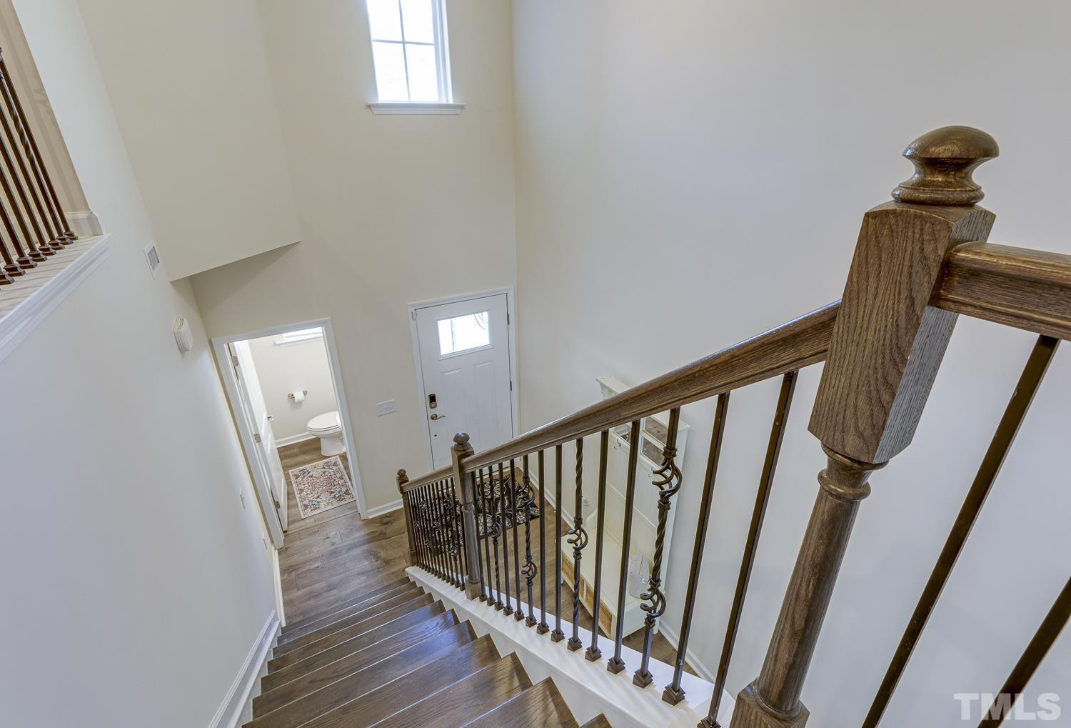 3155 Retama Run New Hill, NC 27562 - Photo 4 of 48 a view of entryway with wooden floor