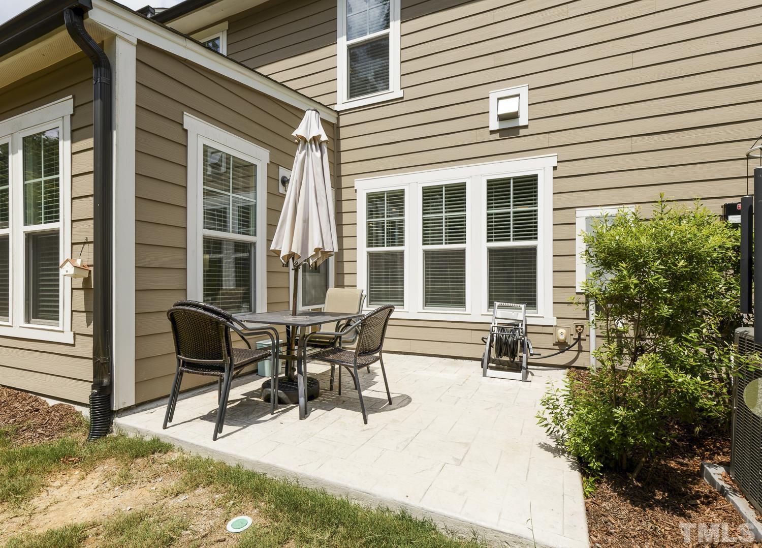 3155 Retama Run New Hill, NC 27562 - Photo 42 of 48 a view of a house with outdoor seating