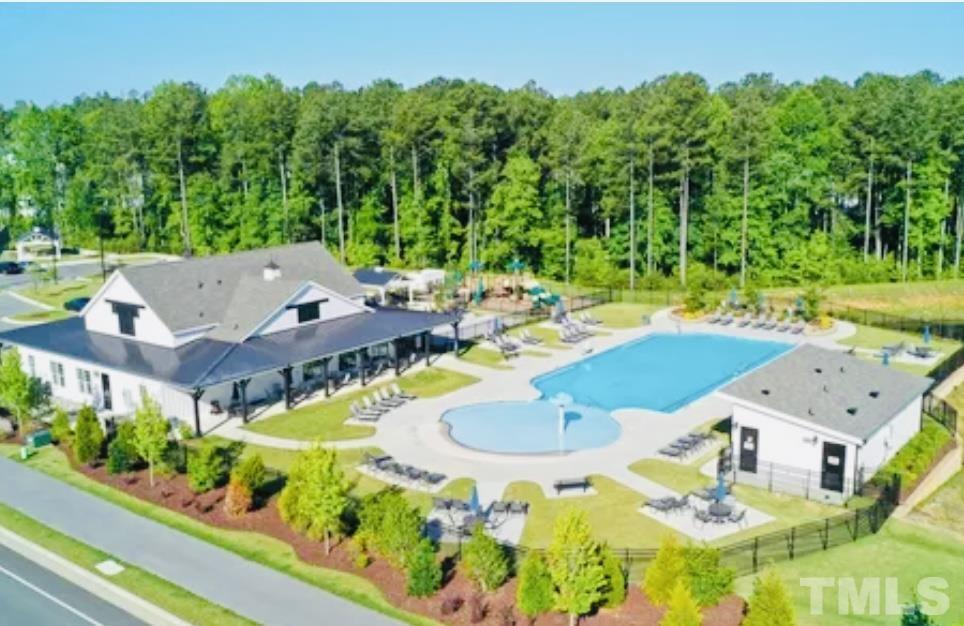 3155 Retama Run New Hill, NC 27562 - Photo 45 of 48 an aerial view of a house with swimming pool garden and patio