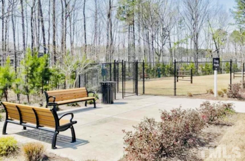 3155 Retama Run New Hill, NC 27562 - Photo 48 of 48 a backyard of a house with table and chairs