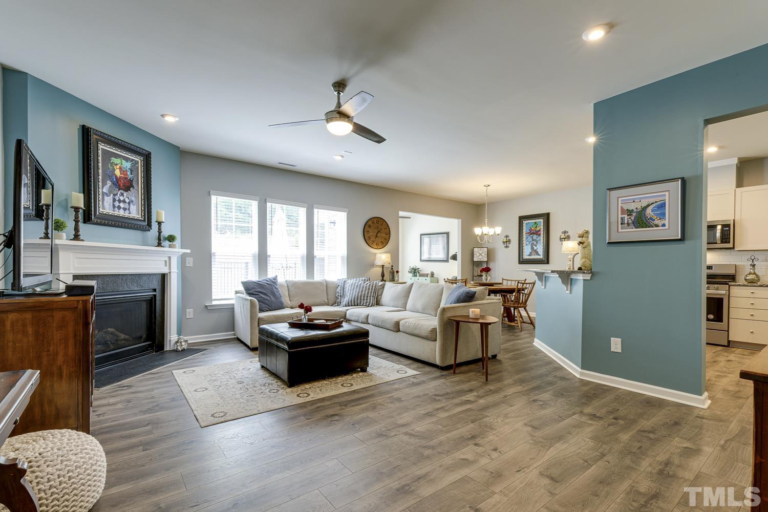 3155 Retama Run New Hill, NC 27562 - Photo 5 of 48 a living room with furniture fireplace and window