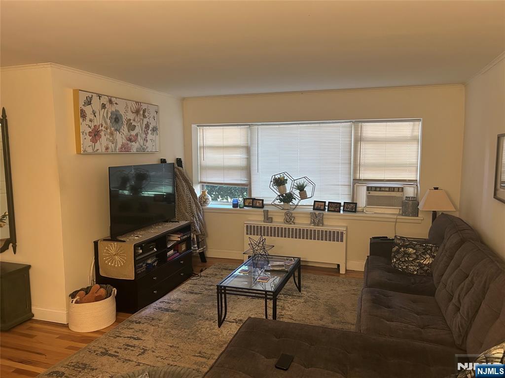 280-320 Oak Street, Unit 280A Ridgewood, NJ 07450 - Photo 5 of 24 a living room with furniture and a flat screen tv