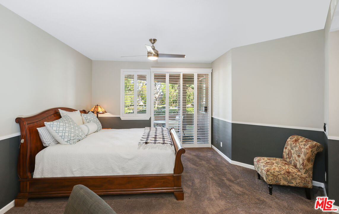 24193 Harbor Ridge Lane, Unit 81 Lake Forest, CA 92630 - Photo 11 of 43 a bed room with a bed and a chair