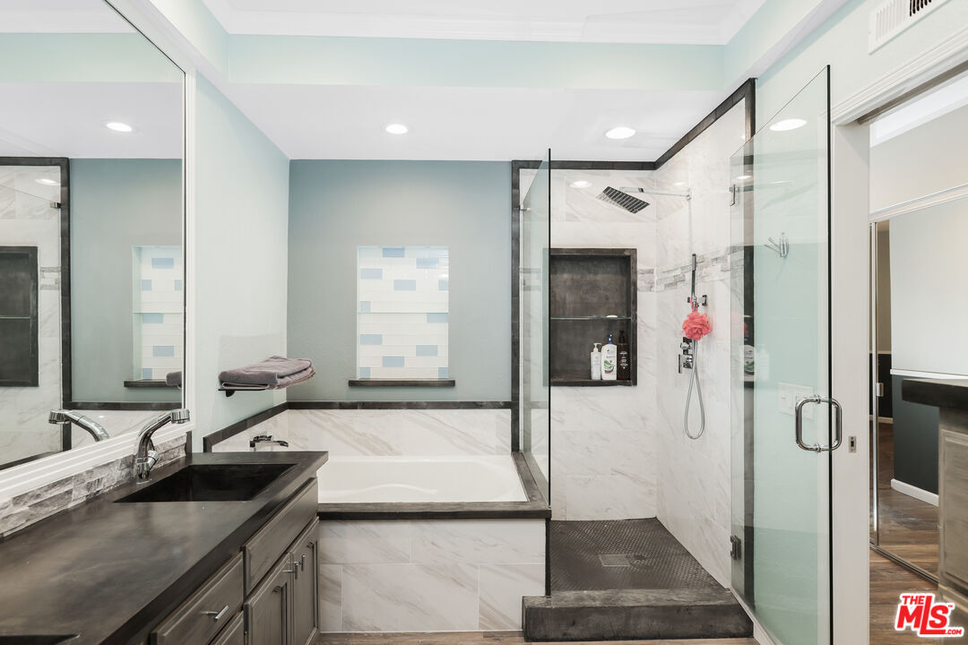 24193 Harbor Ridge Lane, Unit 81 Lake Forest, CA 92630 - Photo 15 of 43 a bathroom with a sink and mirror