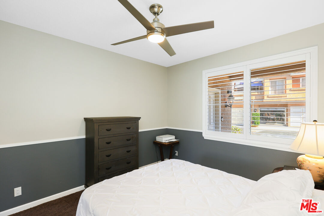24193 Harbor Ridge Lane, Unit 81 Lake Forest, CA 92630 - Photo 17 of 43 a bedroom with a bed and a window