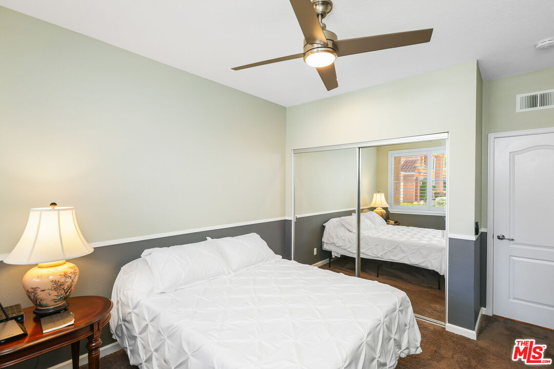 24193 Harbor Ridge Lane, Unit 81 Lake Forest, CA 92630 - Photo 18 of 43 a bedroom with a bed and a window