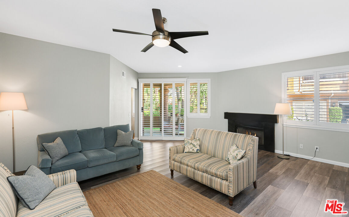 24193 Harbor Ridge Lane, Unit 81 Lake Forest, CA 92630 - Photo 20 of 43 a living room with furniture and a large window